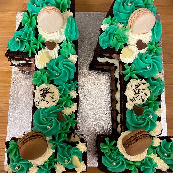 the letter e is decorated with green and white frosting