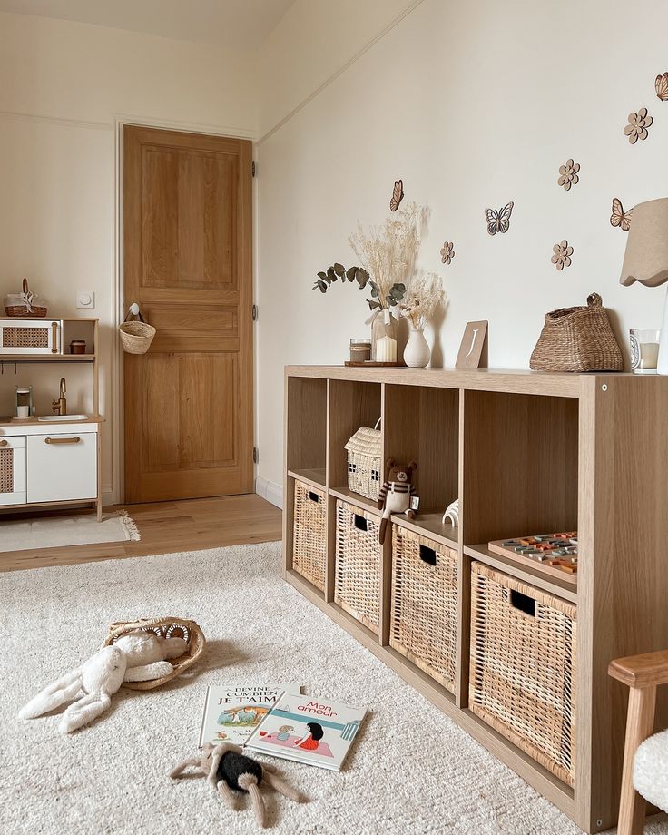 a living room filled with lots of furniture and baskets on top of carpeted floor