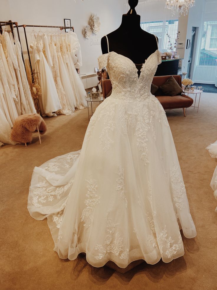 a wedding dress on display in a bridal shop