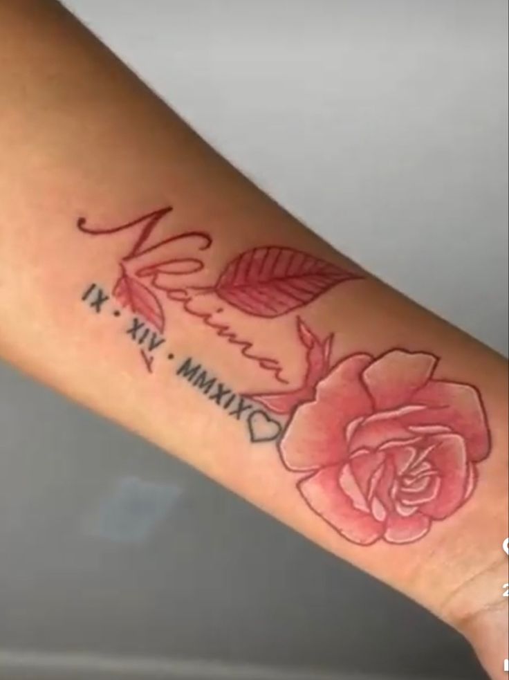 a woman's arm with a rose tattoo on it and the word love written in cursive writing