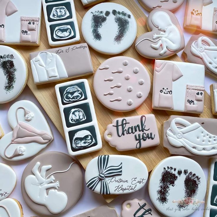 many decorated cookies on a table with thank you written on the top and below them