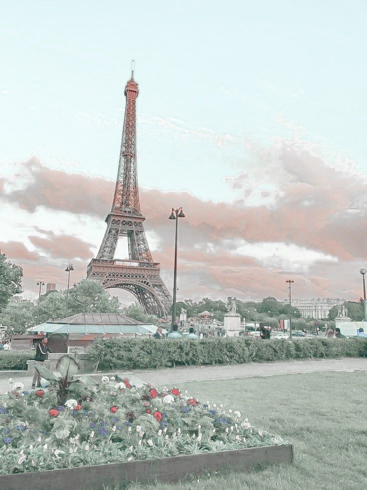 the eiffel tower in paris, france is painted pink and blue with white flowers