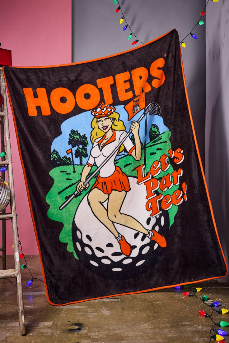 If there's one thing that always makes us smile, it's Hooters. That's why this officially licensed Hooters Tee Time Fleece Blanket is a must-have! Featuring a golf-inspired design, this soft and cozy blanket is the perfect cuddle companion. It's par-tee time!