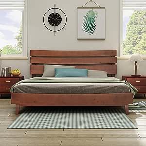 a bed room with a neatly made bed and dressers