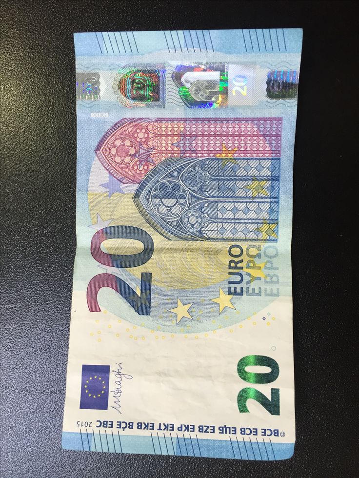 an euro bill with the image of a hand on it