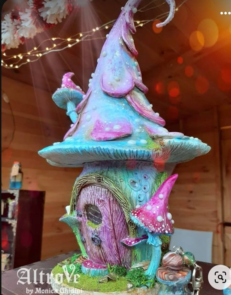 a colorful fairy house on top of a table