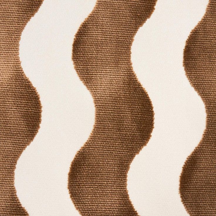 an image of a brown and white wavy pattern on the surface of a fabric material