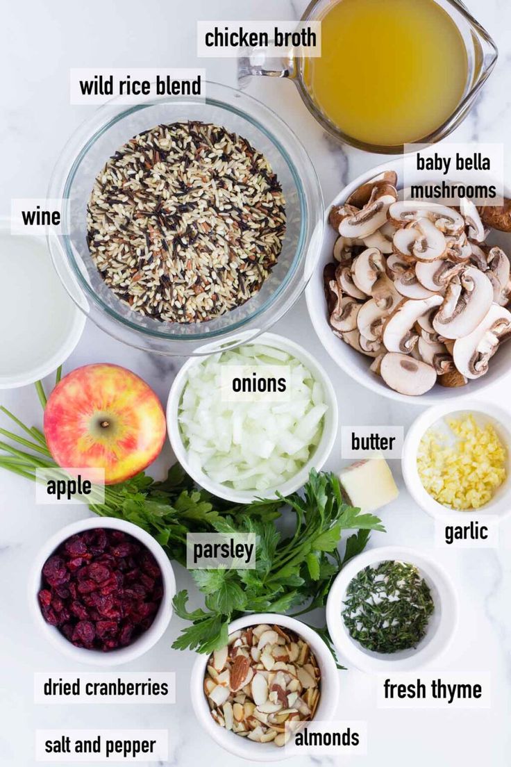 the ingredients to make an apple cider salad are shown in bowls on a marble countertop