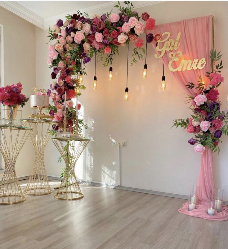 an entrance decorated with flowers and candles