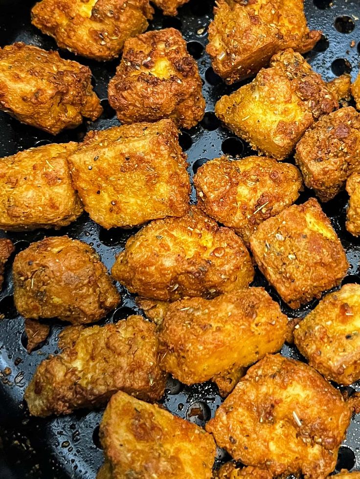 fried food being cooked in a frying pan