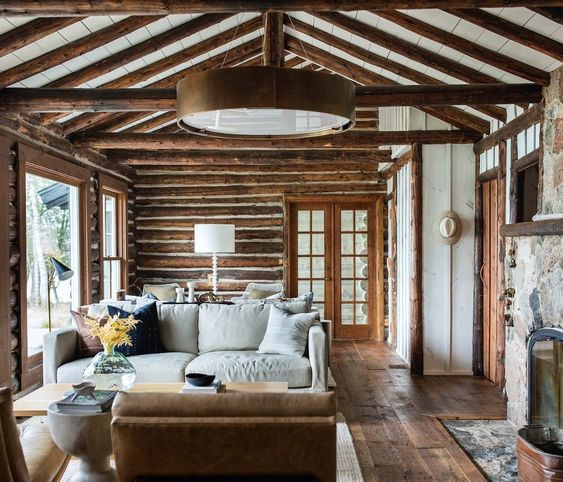 a living room filled with furniture and a fire place