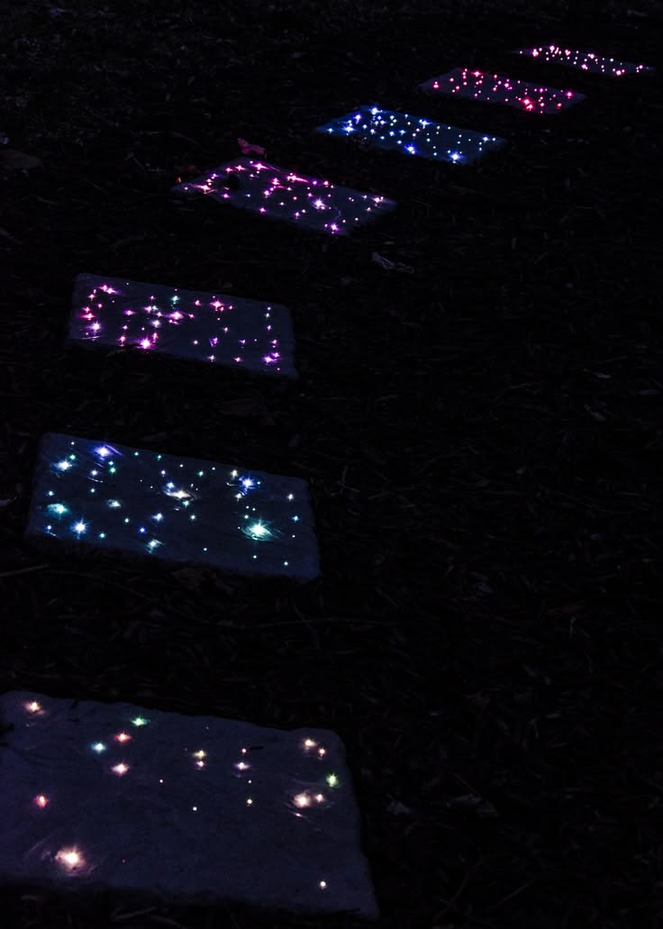 some lights that are on the ground in the dark