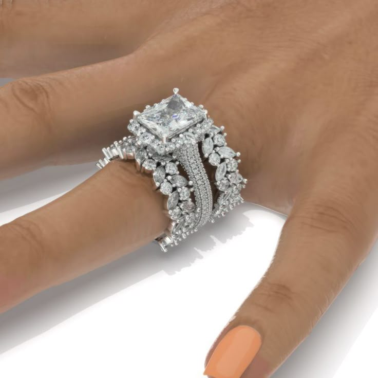 a woman's hand with an engagement ring on it