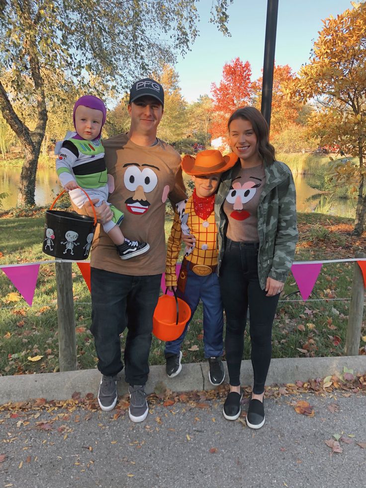 a man, woman and two children posing for a photo