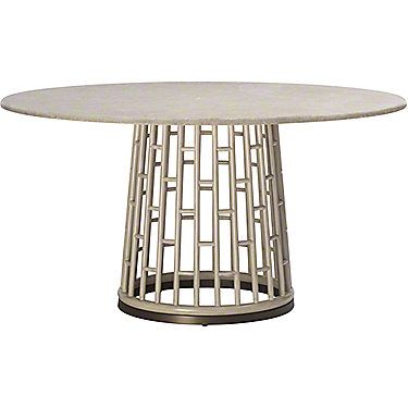 a white marble table with an intricate design on the top and metal frame around it