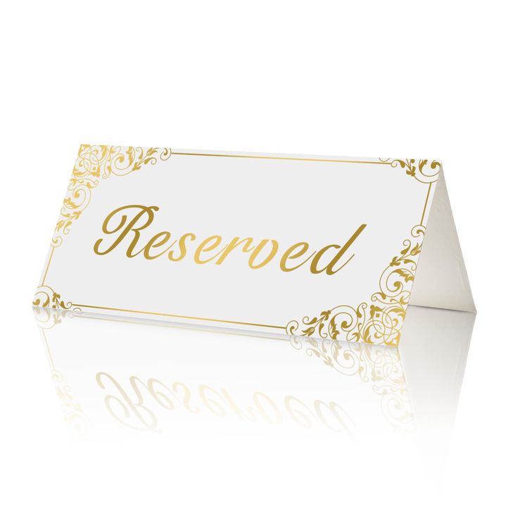 a white and gold reserved card with the word reserved on it