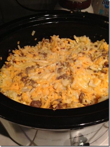 a crock pot filled with food sitting on top of a stove