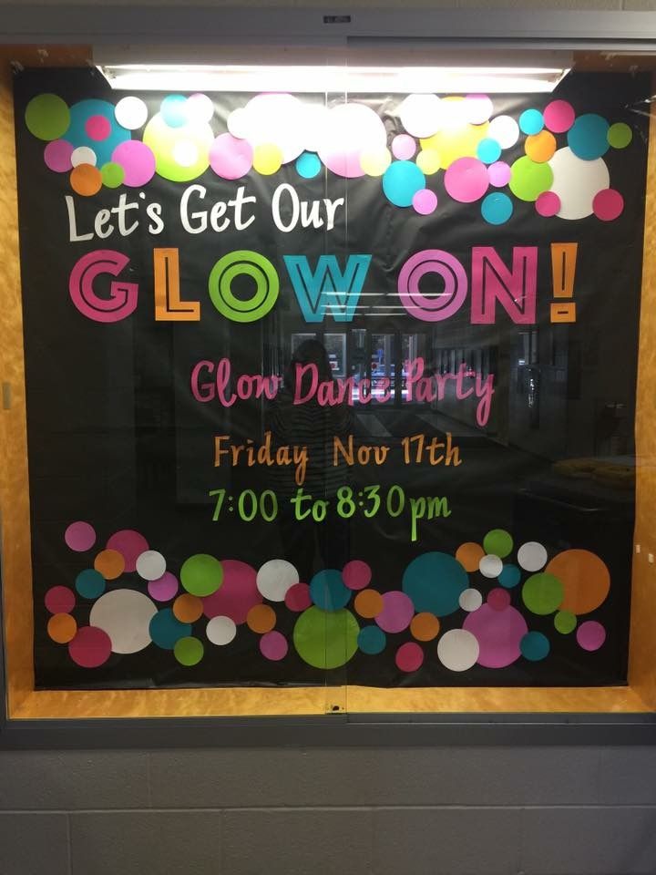 a sign advertising glow on in front of a window that says, let's get our glow on