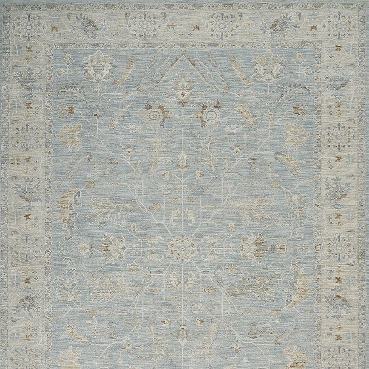 an area rug with blue and beige colors