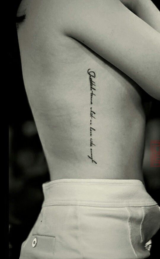 the back of a woman's upper body with an inscription on it