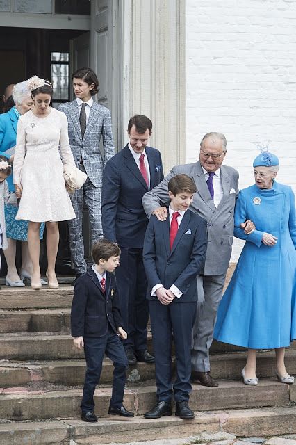 a group of people standing on steps next to each other