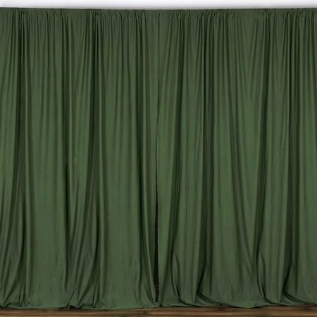 a green curtain is hanging on the wall in front of a white wall and wooden floor