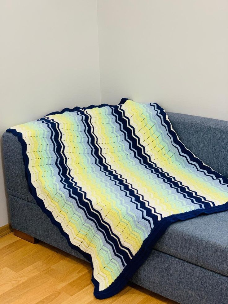 a couch with a blanket on top of it