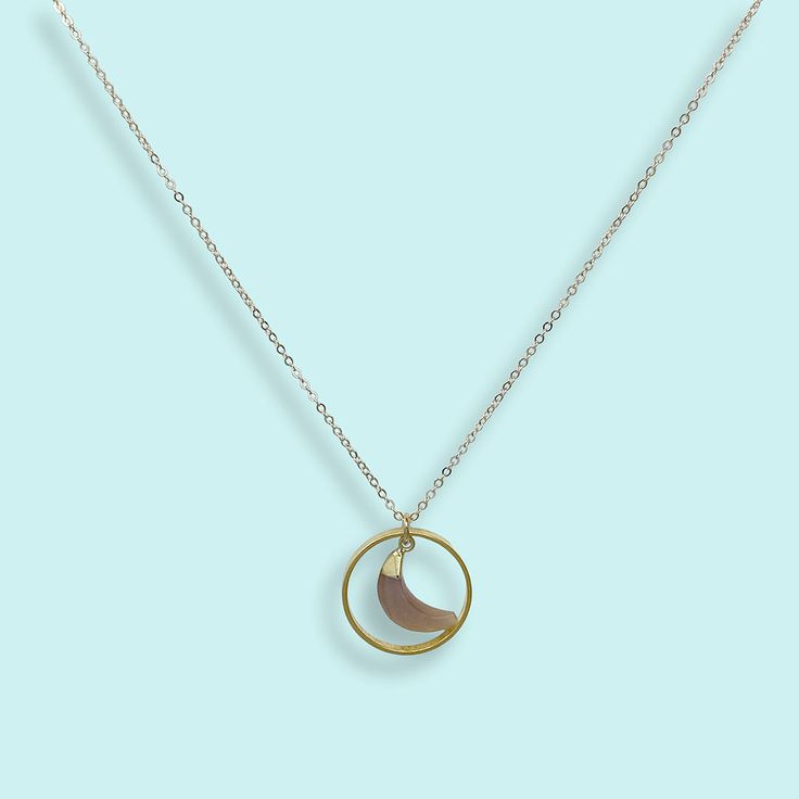 Inspired by the halo of light you sometimes see around the moon. Some believe it means rain or snow is coming but scientists tell us it's caused by the refraction of light from ice crystals suspended in the atmosphere. Chalcedony stone moon in an open circle on gold chain Metal: 24kt gold plating over brass on pendant, 14kt gold filled chain Size: .75" W Pendant, 18" Chain Spring Clasp Available in aqua chalcedony, black onyx, pink sunstone, and green amazonite Available on 16", 18" or 20" chain Moon Halo, Refraction Of Light, Moon Necklace Silver, Green Amazonite, Gold Moon Necklace, State Necklace, Halo Necklace, Ice Crystals, Chalcedony Stone