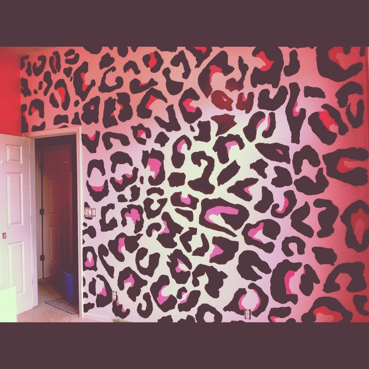 a pink and black wall with leopard print on it