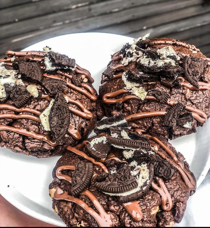 chocolate cookies and oreo cookies on a white plate