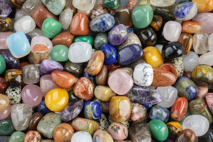 many different colored rocks are stacked together