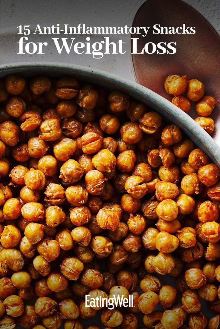 a bowl filled with lots of nuts on top of a table