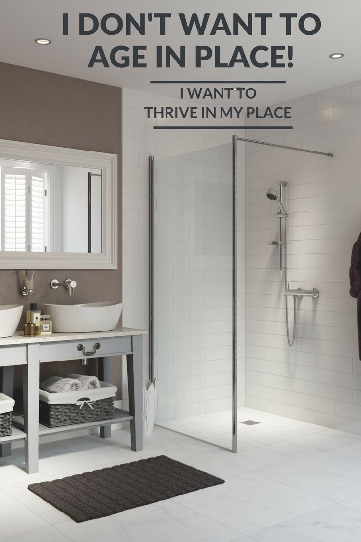 a bathroom with a walk in shower next to a sink