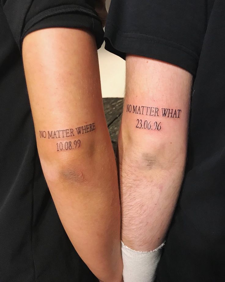 two people with tattoos that say no matter where