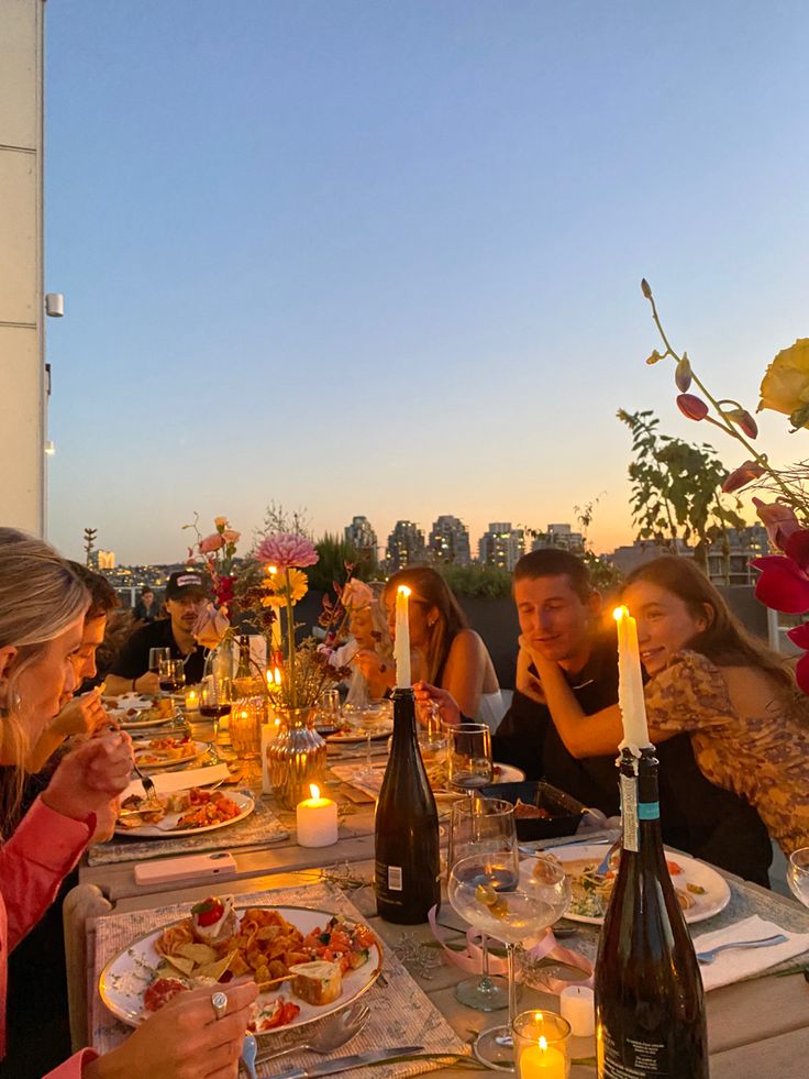 a group of people sitting around a dinner table