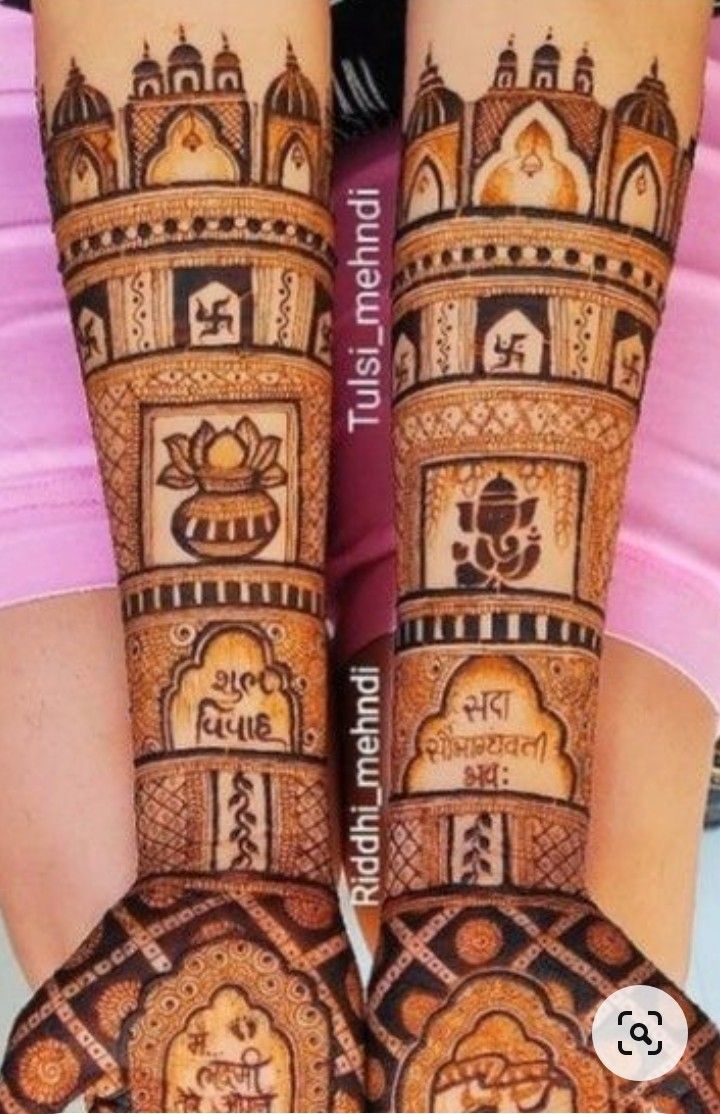 two hands with henna designs on them