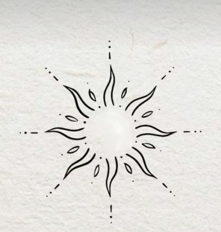 a black and white drawing of a sun