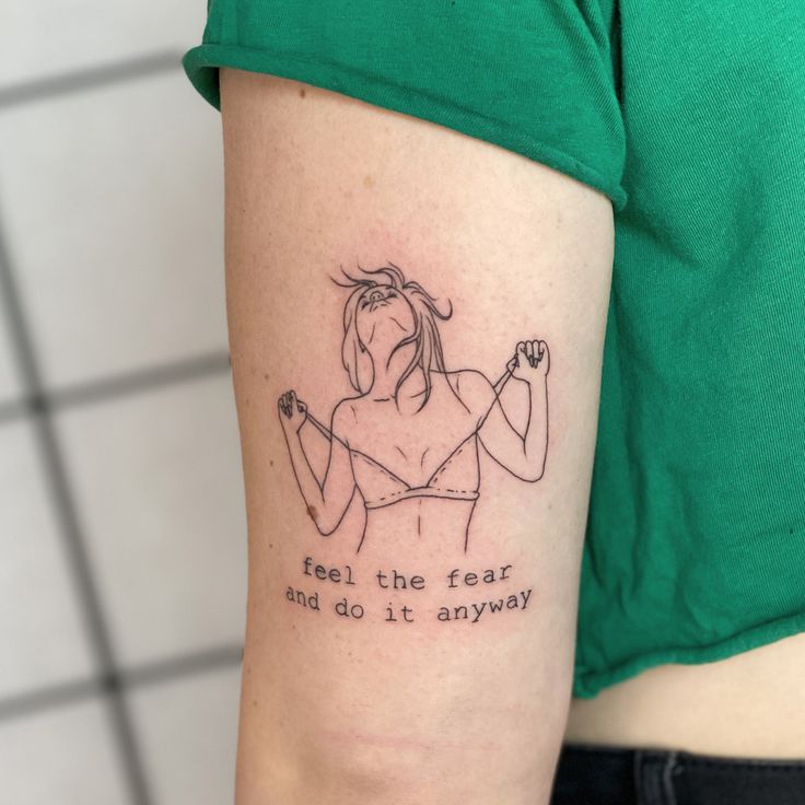 a woman's arm with a tattoo saying, feel the fear and do it anyway