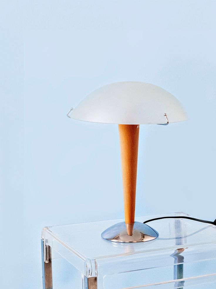 a table lamp sitting on top of a clear box