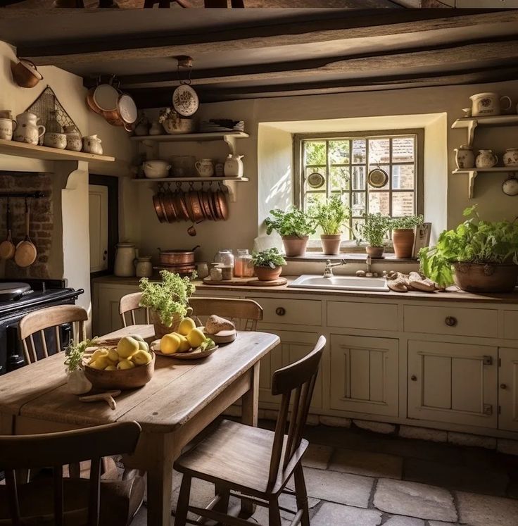 a kitchen filled with lots of pots and pans next to a stove top oven