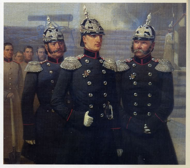 two men in uniform standing next to each other