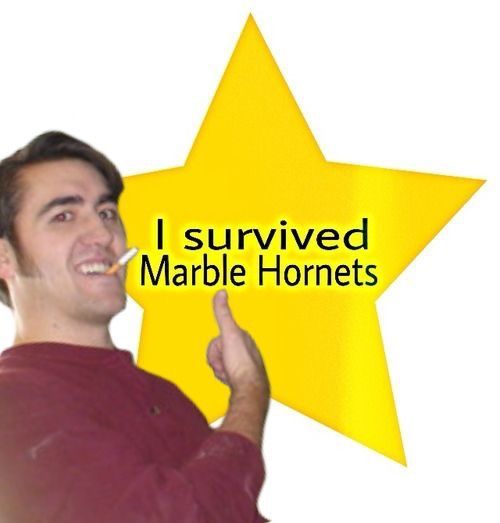 a man pointing to a yellow star with the words i survived marble horrets written on it