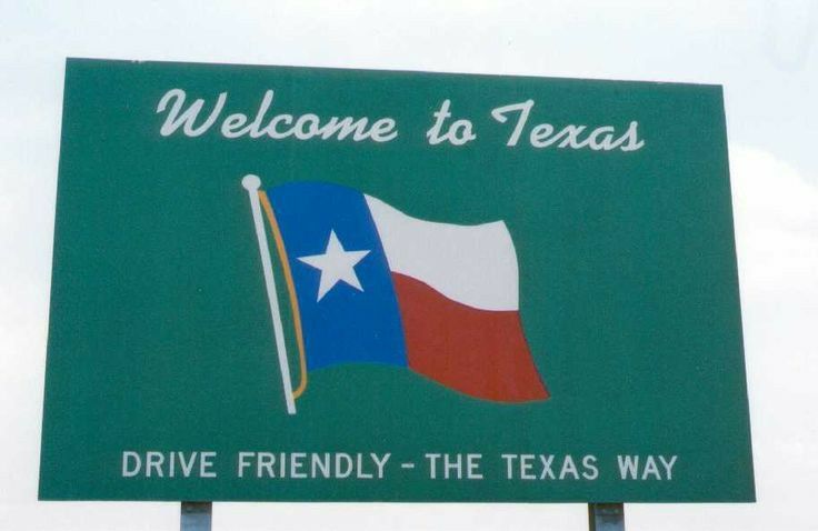 a welcome sign to texas with the flag on it's back and words that read, drive friendly - the texas way