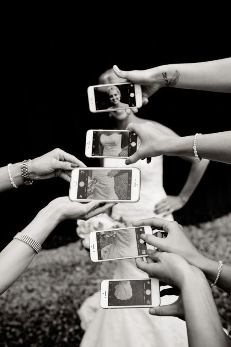 a group of people holding up cell phones in front of each other with pictures on them