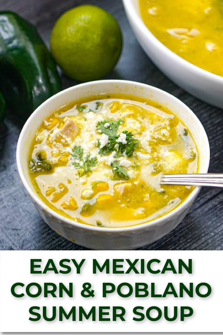 two bowls of mexican corn and poblano soup with limes in the background