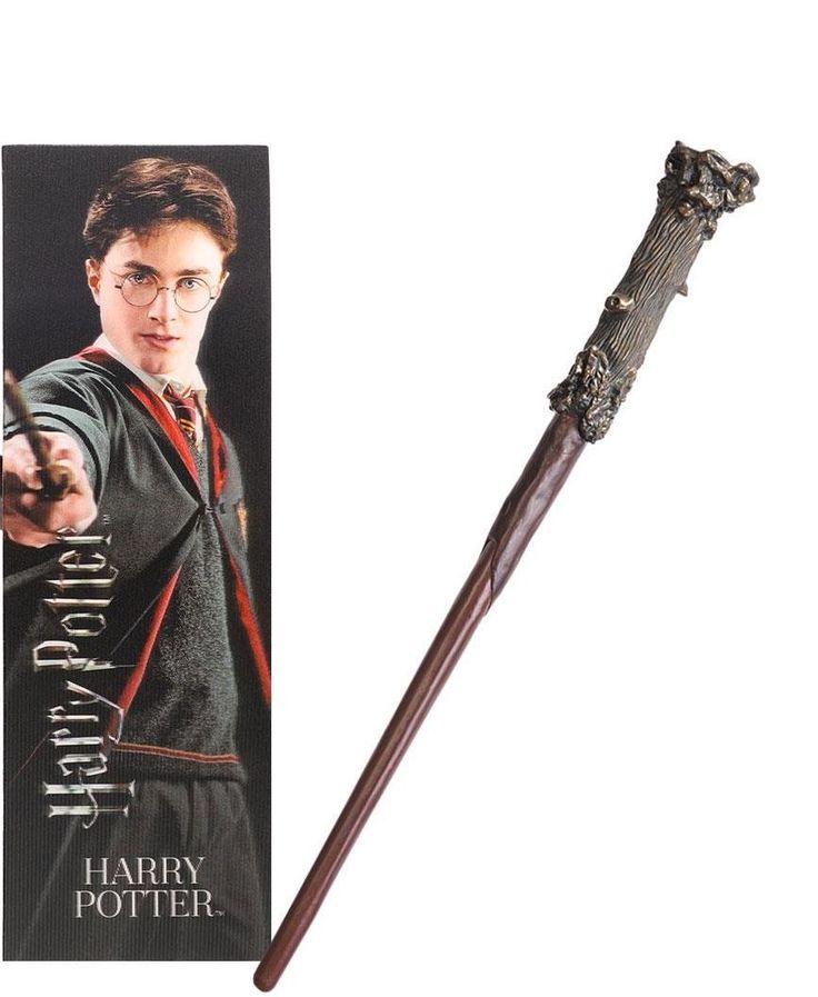 a harry potter wand is shown next to a card