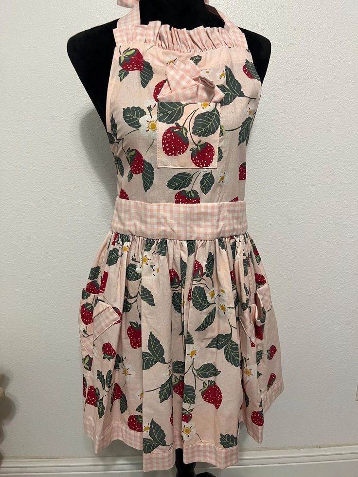 an apron dress with cherries and gingham