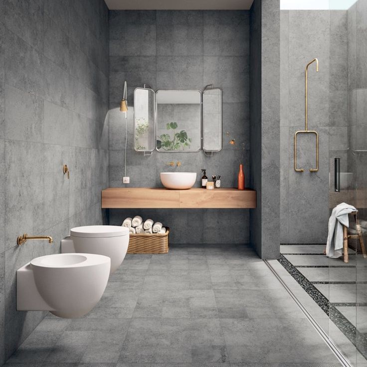 a modern bathroom with two sinks and large mirrors on the wall, along with an open shower