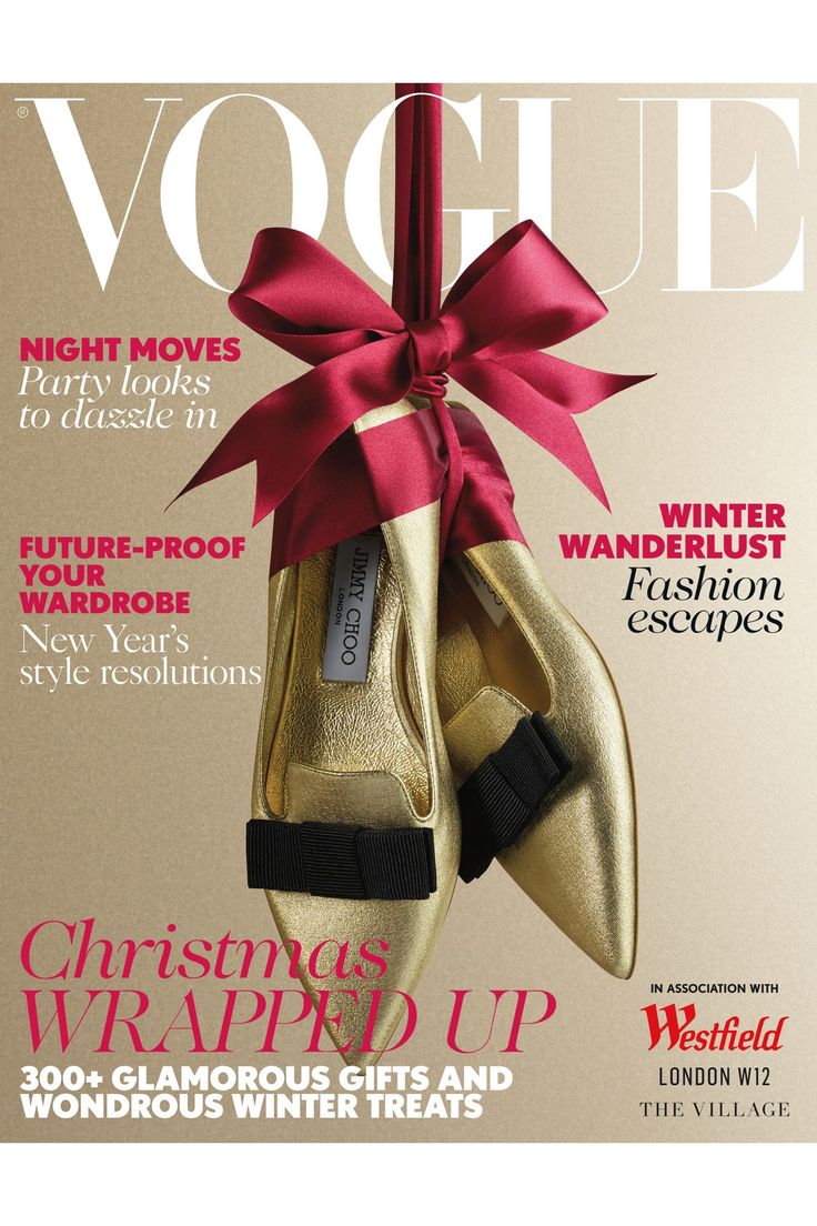 a magazine cover with a pair of gold shoes tied to a pole and a red bow