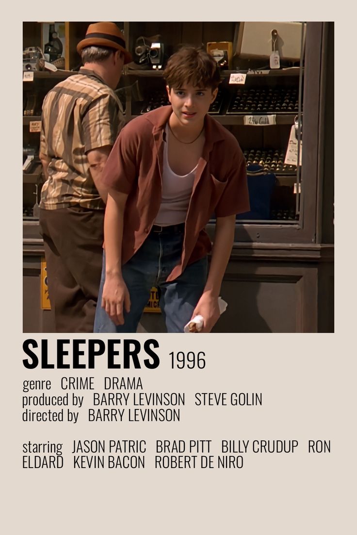 two men standing next to each other in front of a store window with the words sleepers on it